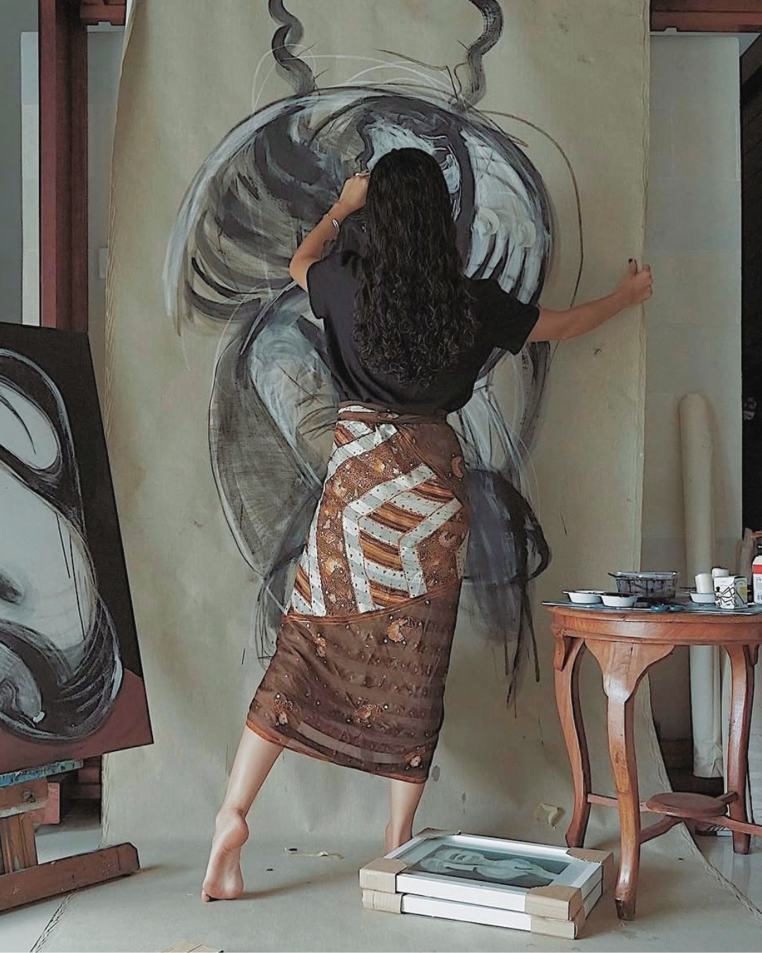 Ubud — a Balinese artist at work in her studio