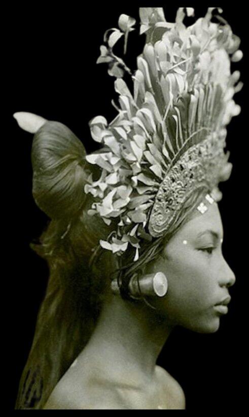 Balinese statue with traditional floral headdress